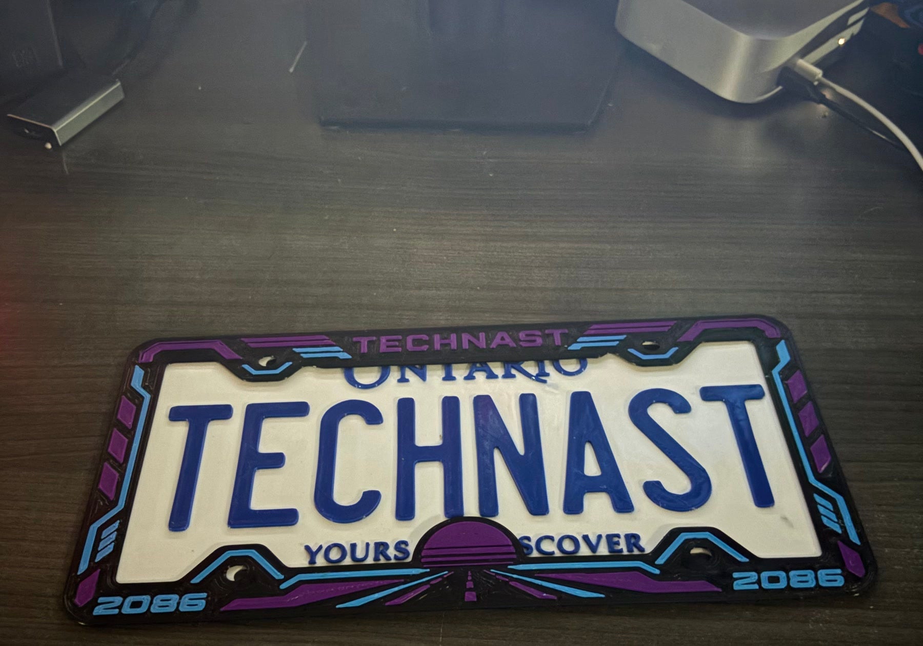 Real photo of the Neon Horizon frame in Purple and Blue.